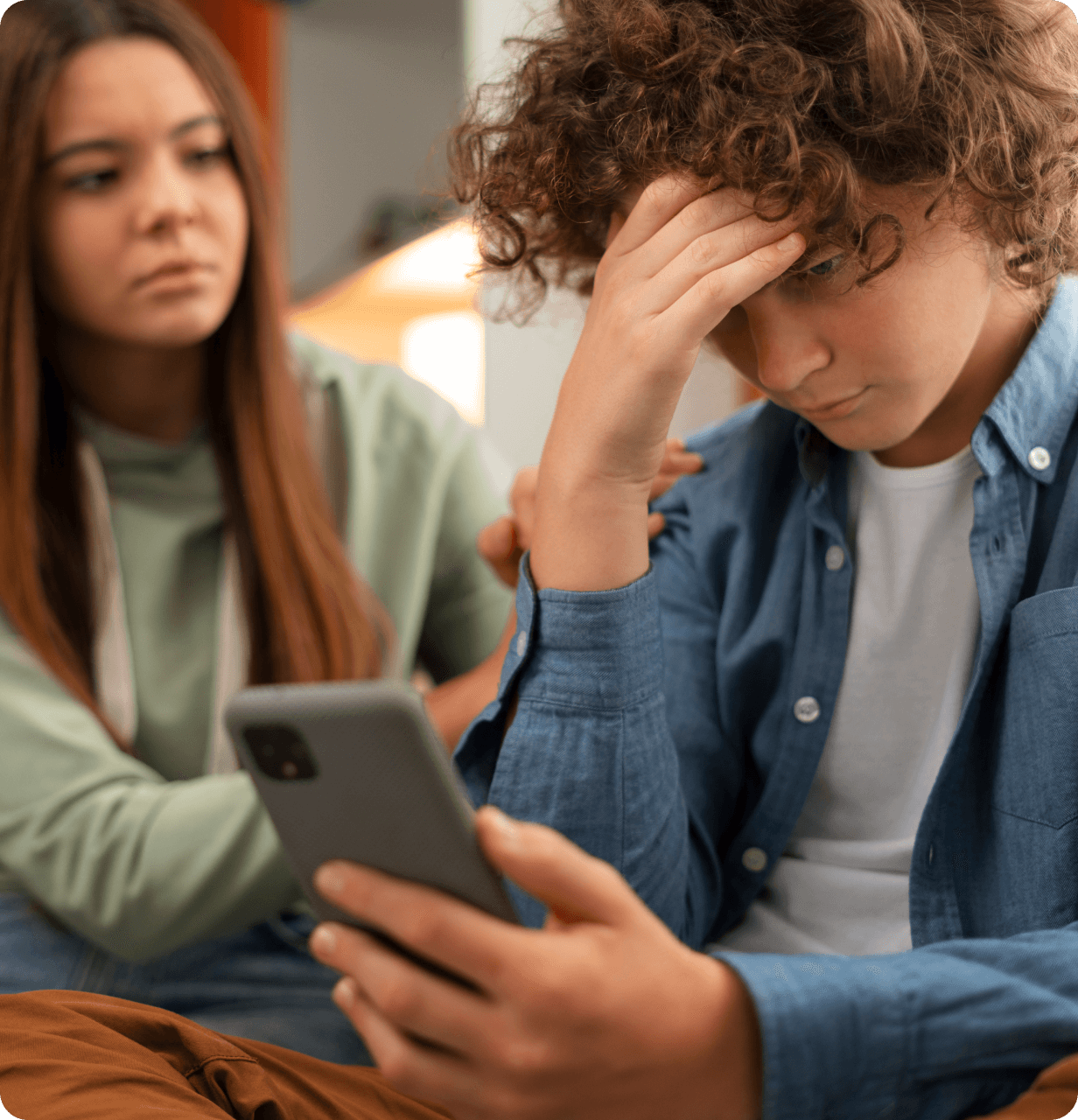 Troubled teen looking at phone