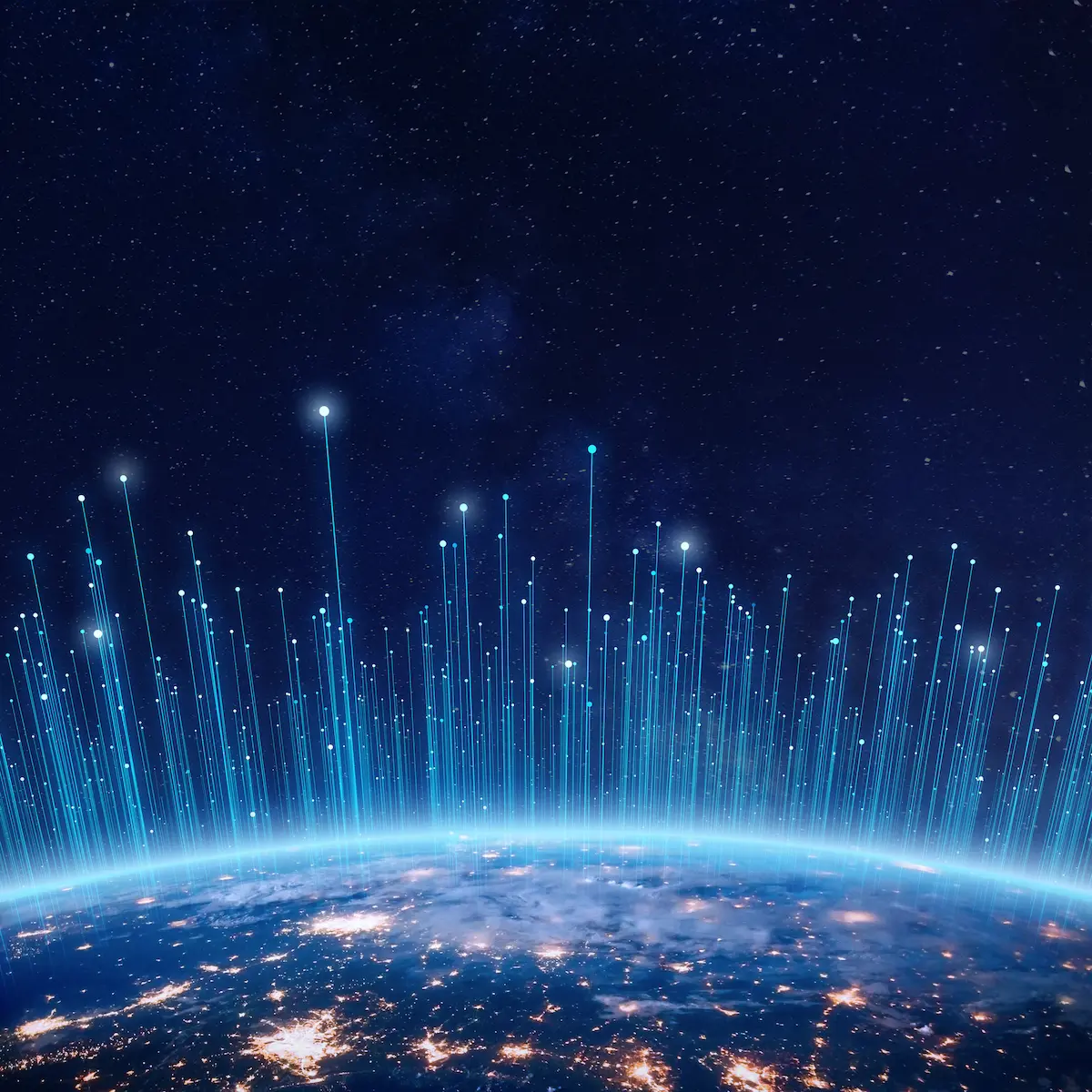 Night view of Earth with glowing network lines extending into space.