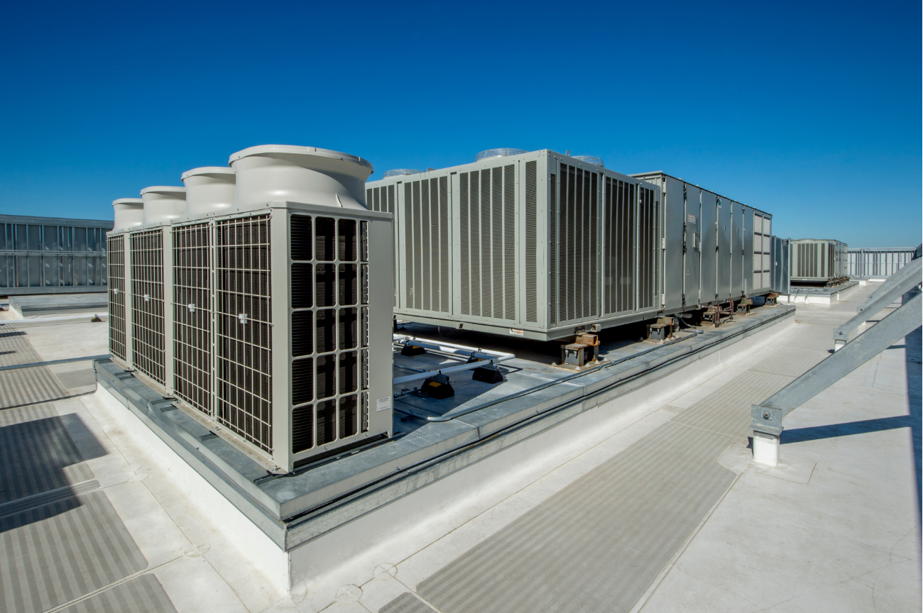 Rooftop HVAC units serviced on a large commercial site, representing readiness for higher-value work.