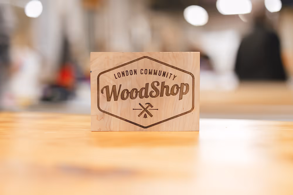 London Community Woodshop logo embossed into block of wood