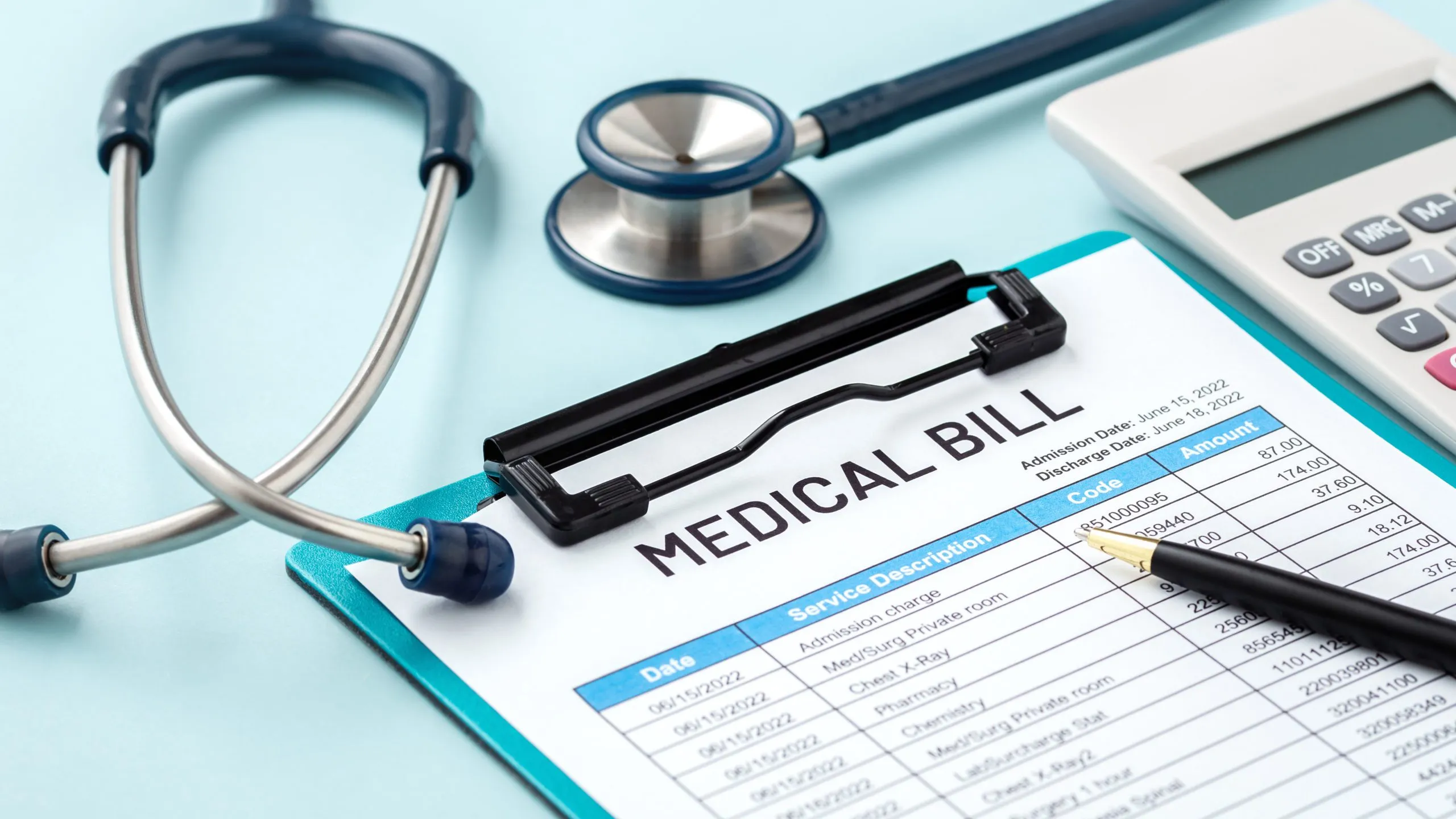 Stethoscope and clipboard with medical bill highlight small business insurance essentials.