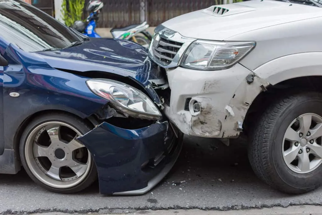 A blue car and a white SUV with commercial auto insurance collided in South Florida.