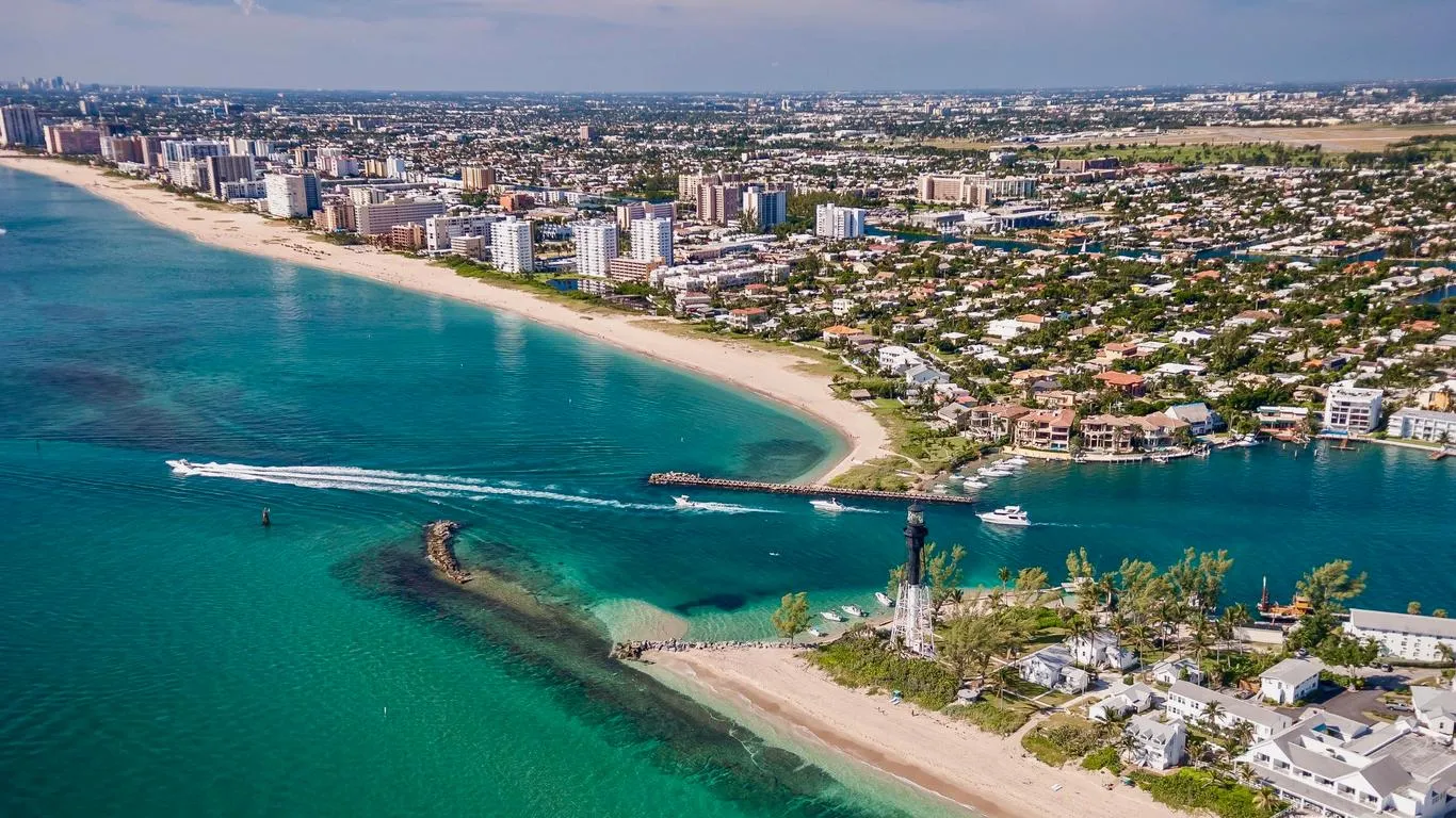 Aerial view of Pompano Beach’s scenic shoreline, blue ocean, and waterfront homes highlighting Florida living.