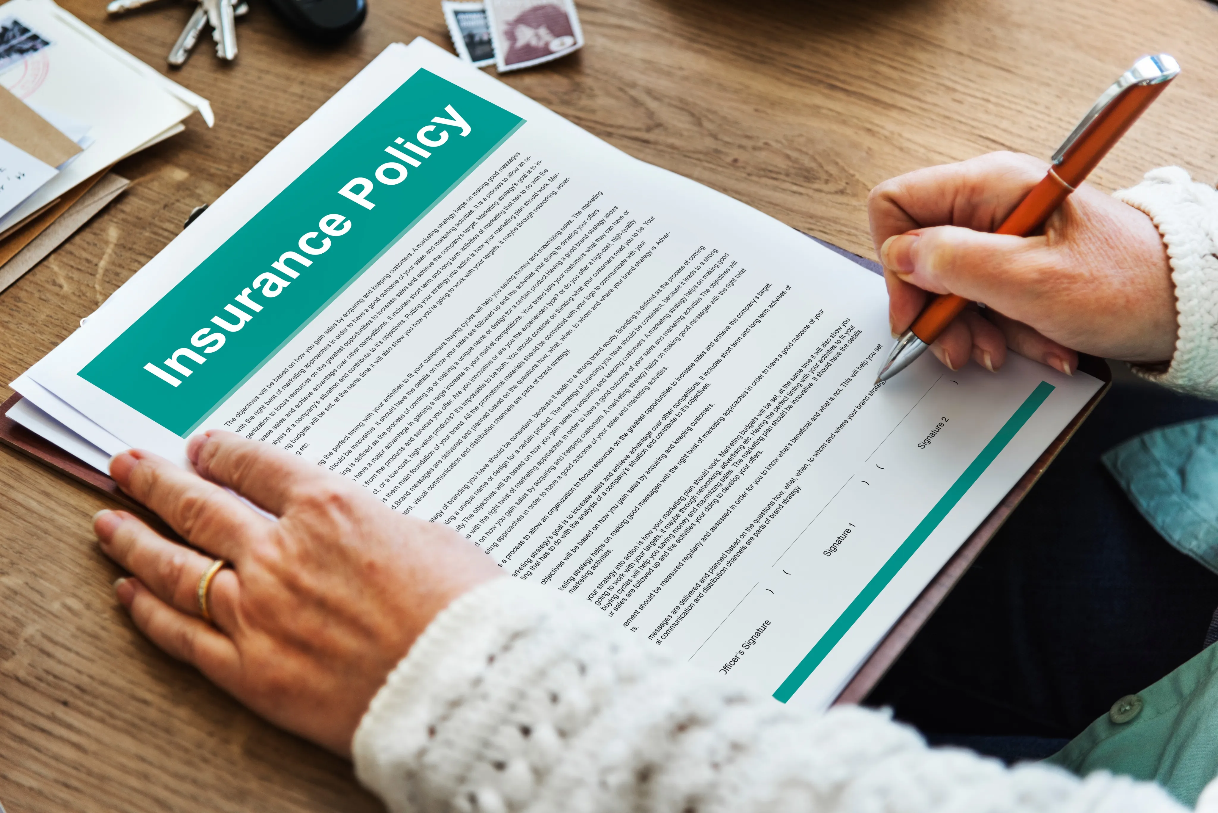 A person filling up an insurance policy.