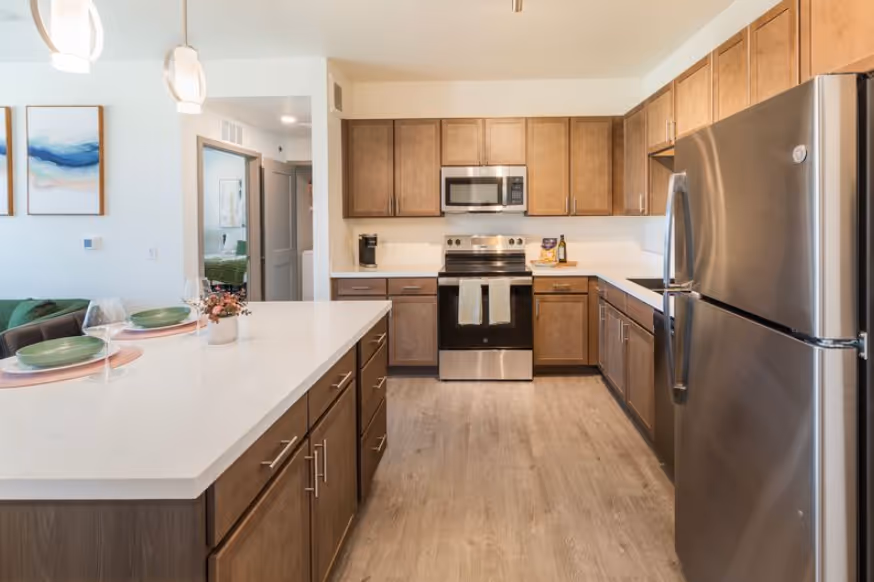 Luxurious resident lounge with comfortable sofas, unique ceiling design, fireplace, and large windows offering scenic views at Pueblo Springs, Pueblo West, CO.