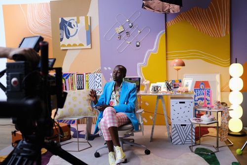 Behind the scenes video shoot for Pinterest with a model posing at a creative studio space