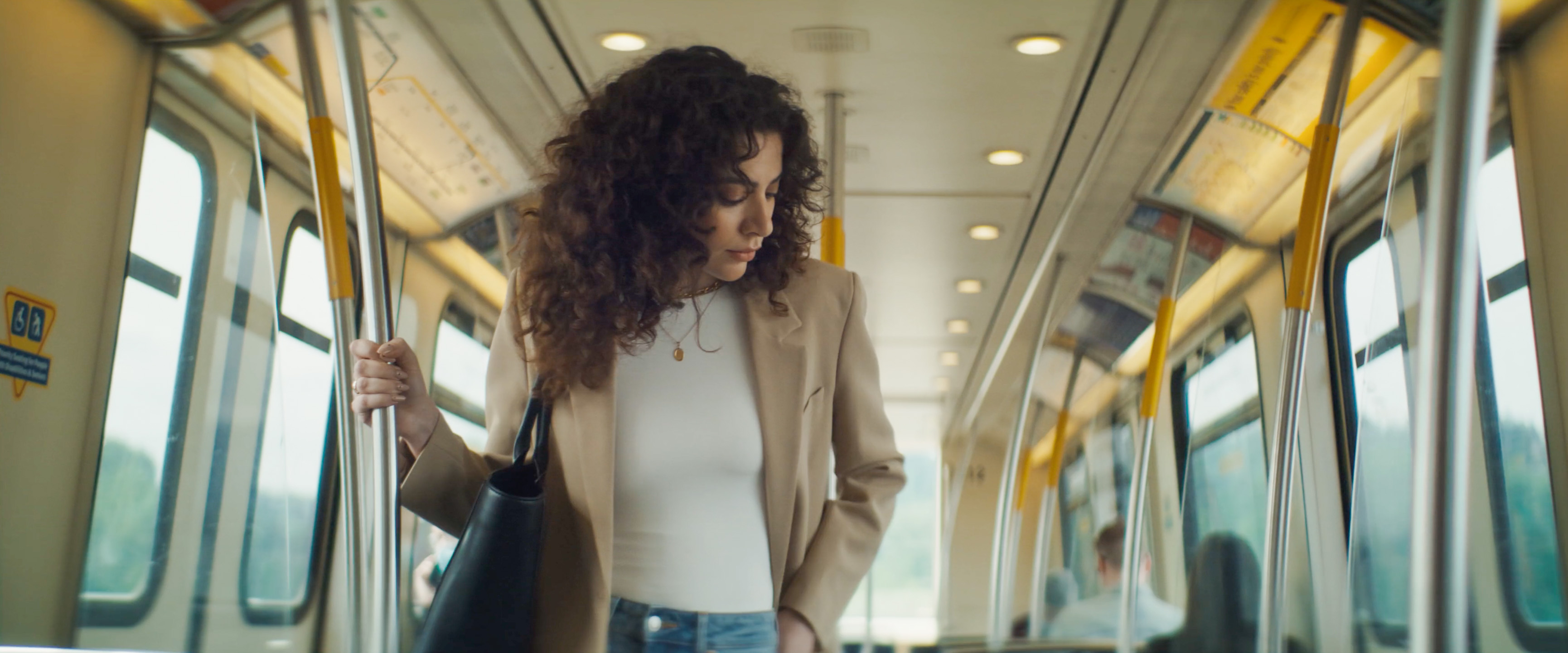 Still frame from a NoraVera commercial filmed on the Vancouver SkyTrain