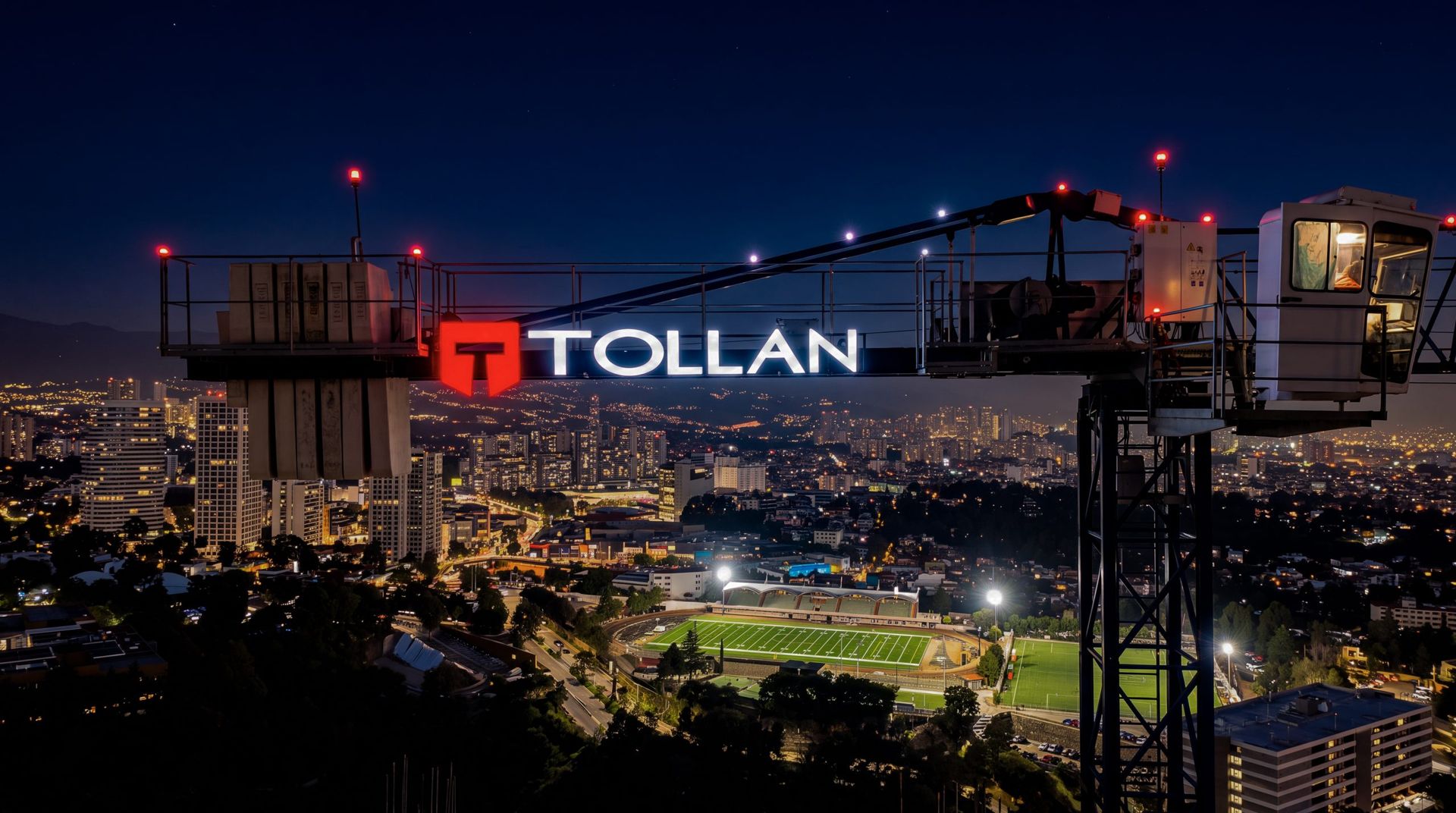 Grúa de Tollan con el letrero iluminado sobre la Ciudad de México de noche