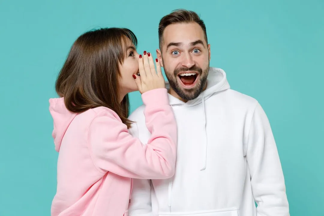A man and a woman standing next to each other.