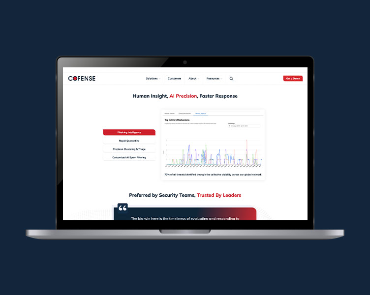 A laptop open to Cofense's website.