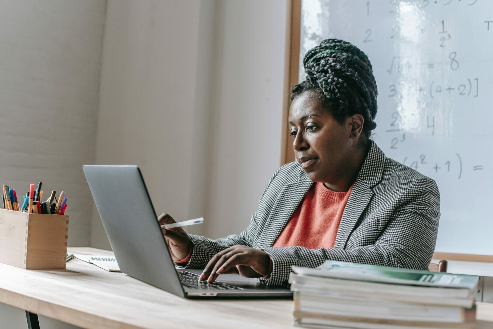 Person working on a laptop at a desk