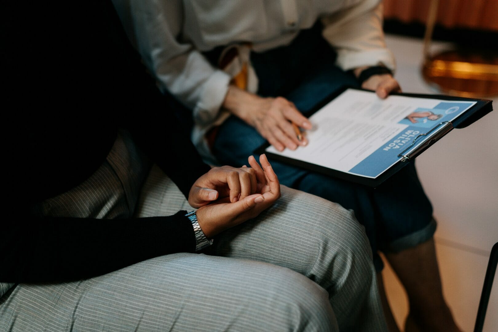 Person holding a tablet with a document displayed