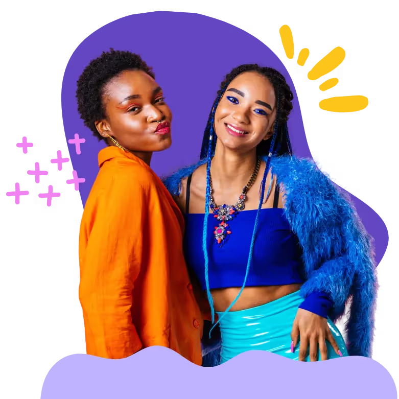 Two smiling women, one in an orange jacket and the other in a blue crop top and furry jacket, against a purple background. | SisterLove Inc Atlanta HIV Testing for AIDS symptoms near me.