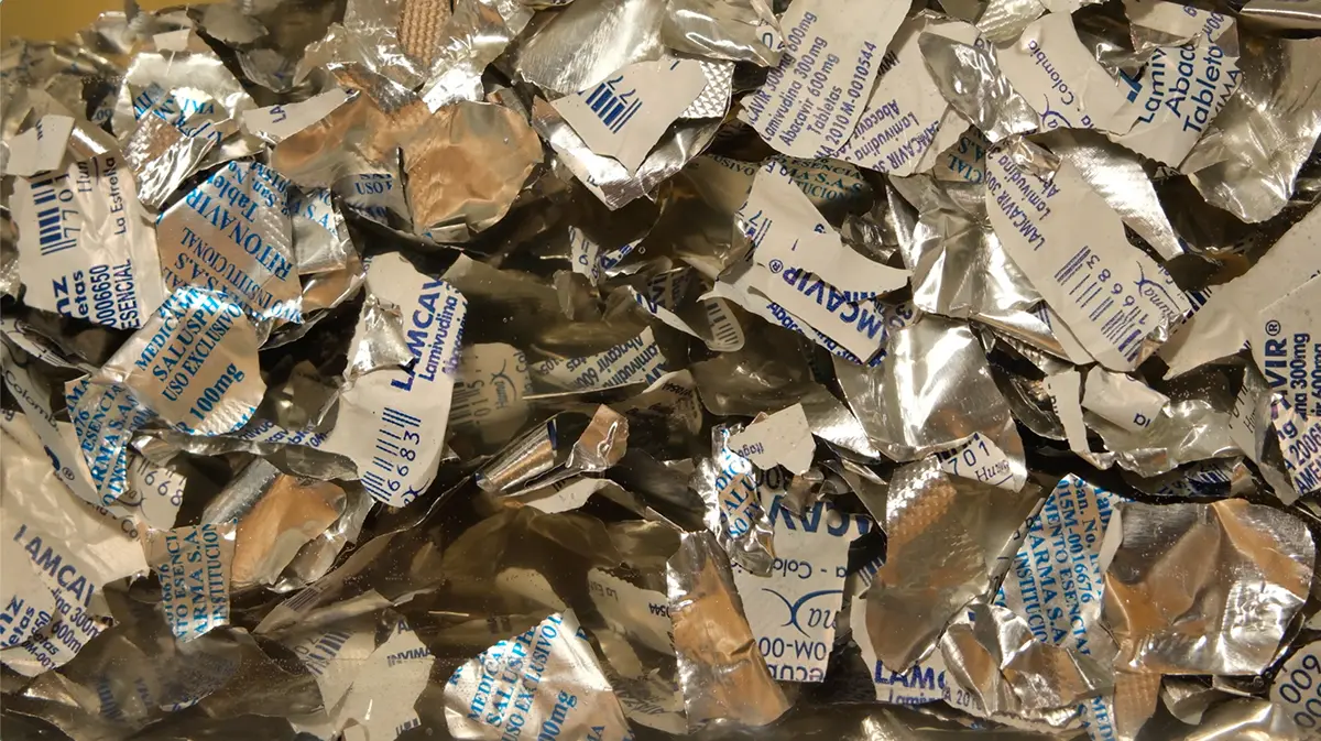 a collection of empty pill wrappers for HIV medication