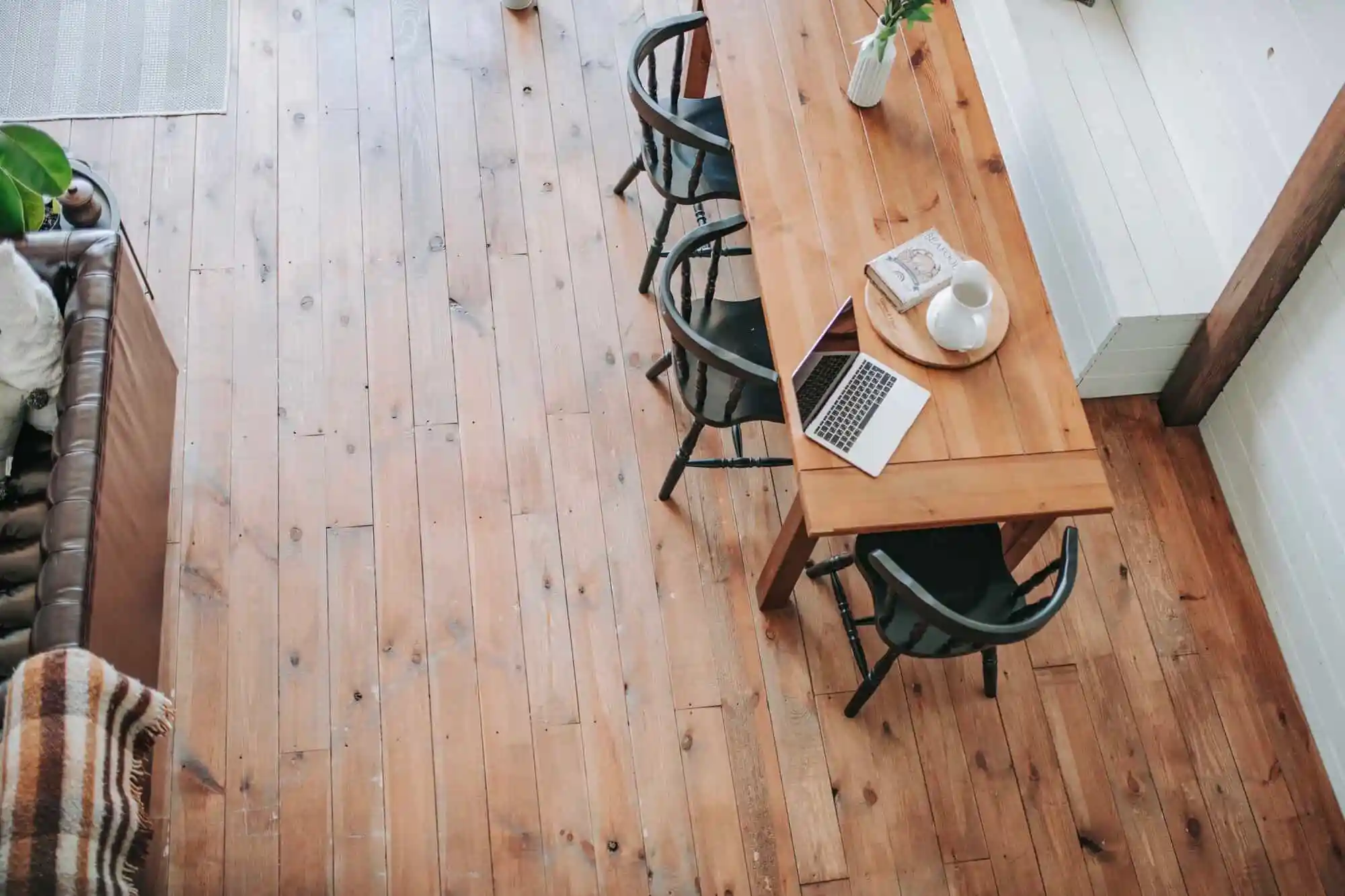 top view of office community table on light hardwood floor