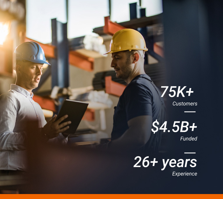 Two people in a factory discussing data, with a text overlay pointing out that National Funding has helped 75k+ customers, funded $4.5 billion dollars and has 25 years of experience.