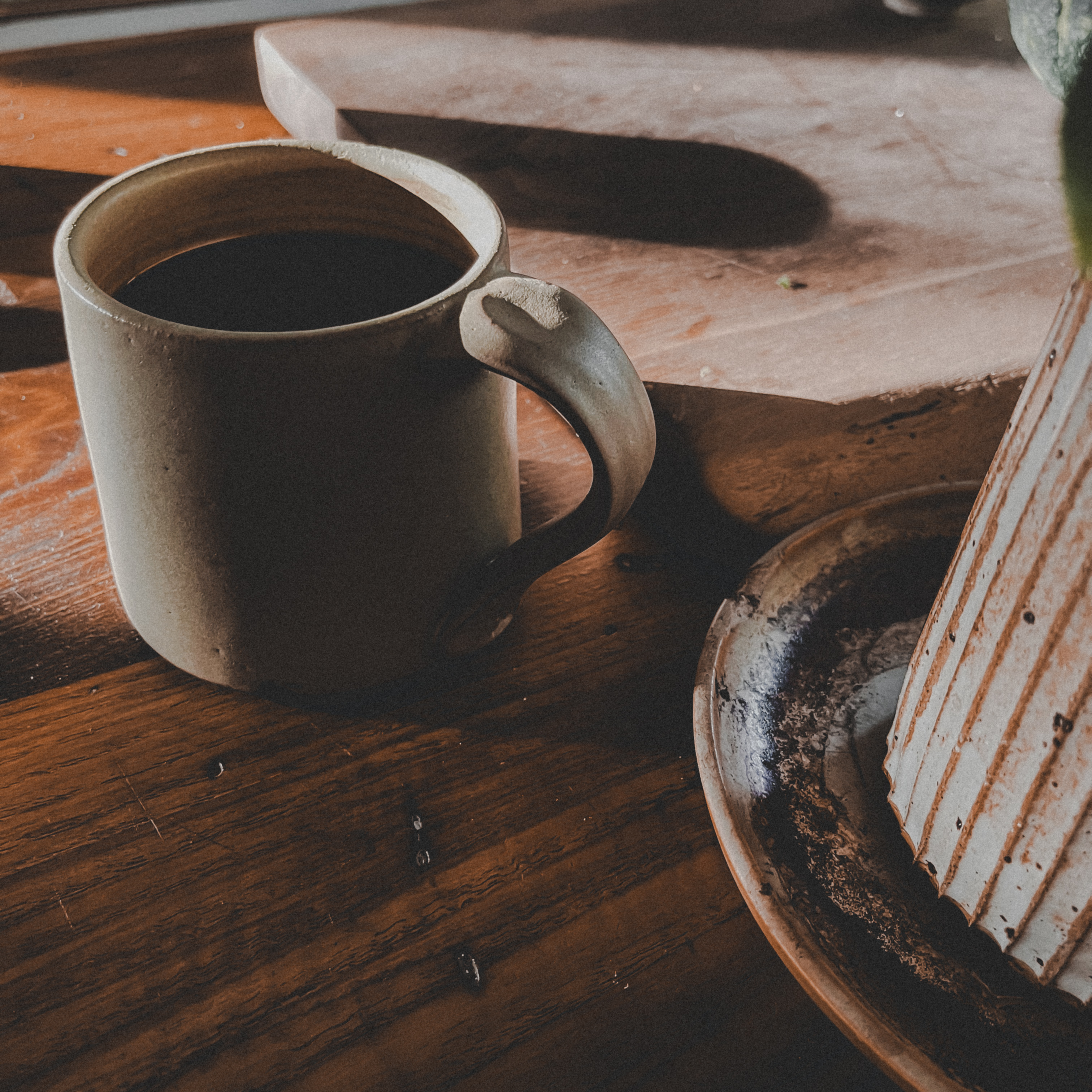 Warm coffee scene with a mug and baked goods.