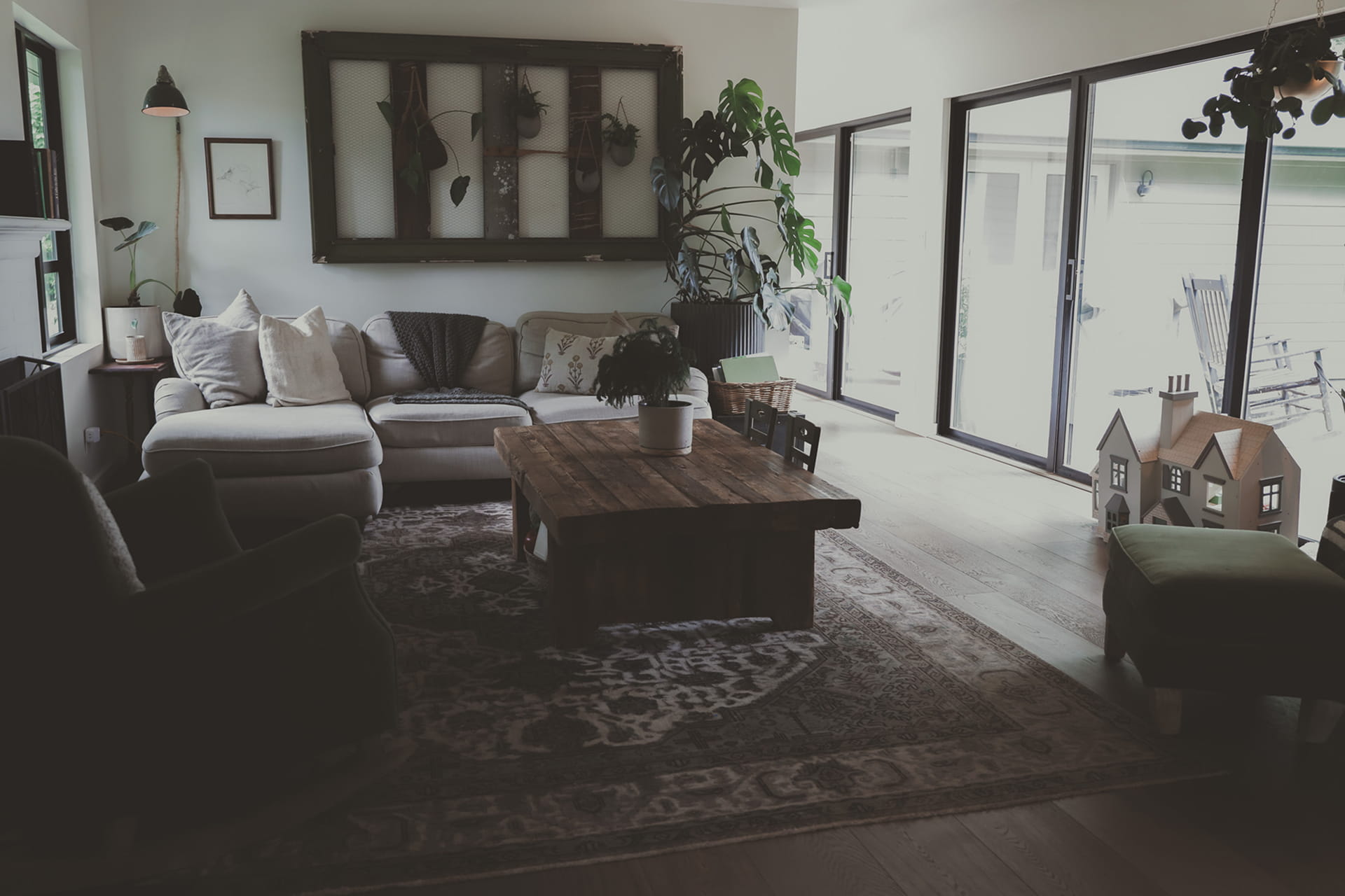 Elegant living room with vintage furniture and framed art.