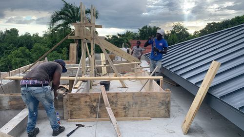 Metal roofing installation being completed by Marcore Construction Group, roofing construction company