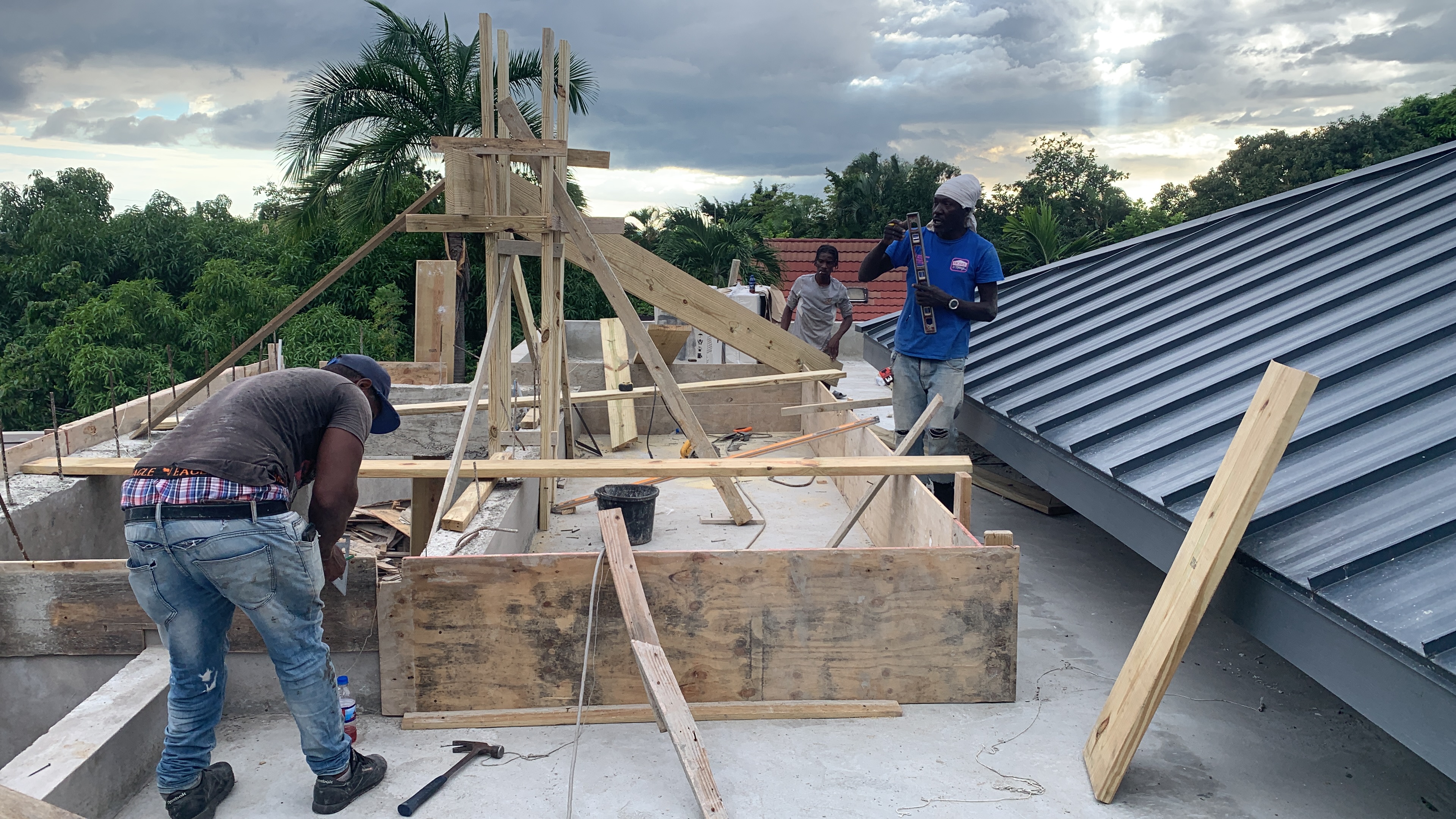 Metal roofing installation being completed by Marcore Construction Group, roofing construction company