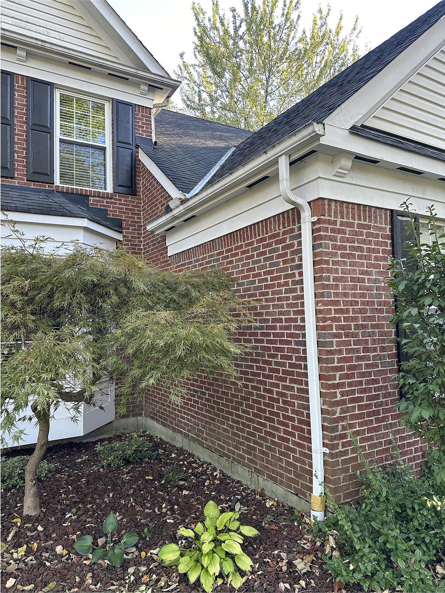 Seamless gutters and gutter guard system installed on a residential home