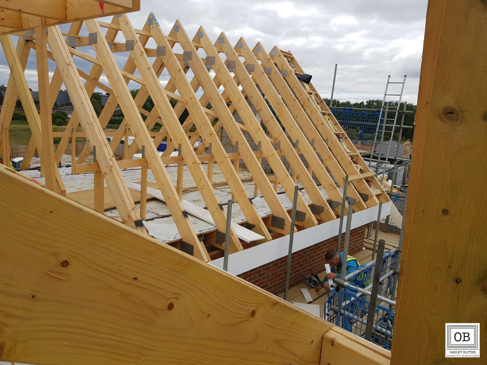 A new residential roof being fitted by Oakley Blythe Quantity Surveyors