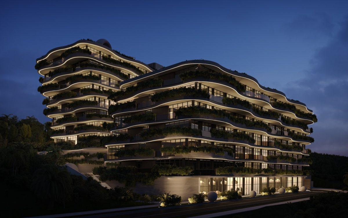 Illuminated facade of the complex at dusk — Sunny Moon Phuket, Nai Harn