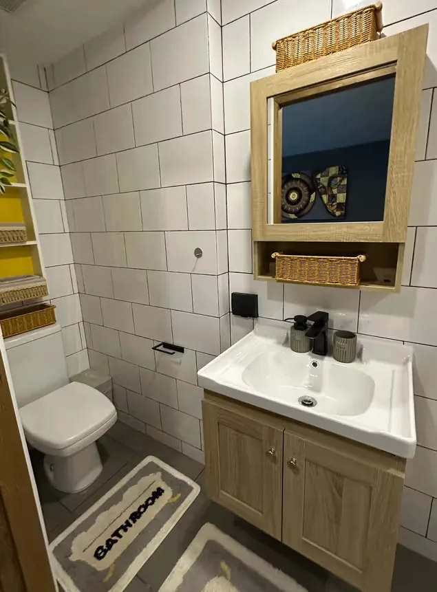Bathroom with timber vanity and framed mirror — Utopia Nai Harn, Nai Harn