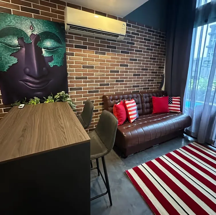 Living room with breakfast bar and brick wall — Utopia Nai Harn, Nai Harn