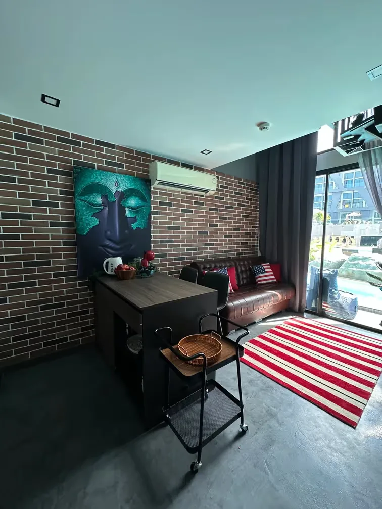 Living room with kitchen and terrace access — Utopia Nai Harn, Nai Harn