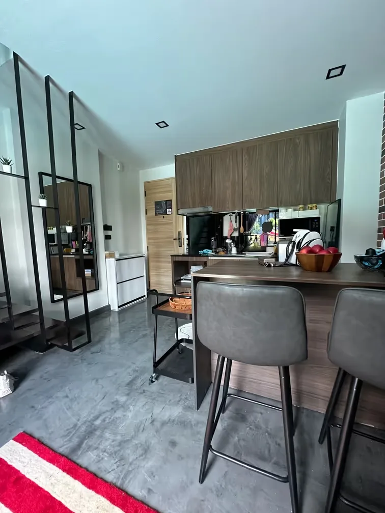 Open-plan kitchen and living room with breakfast bar and mirror — Utopia Nai Harn, Nai Harn
