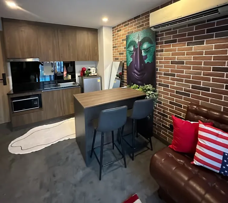 Kitchen with microwave and a three-seat breakfast bar — Utopia Nai Harn, Nai Harn