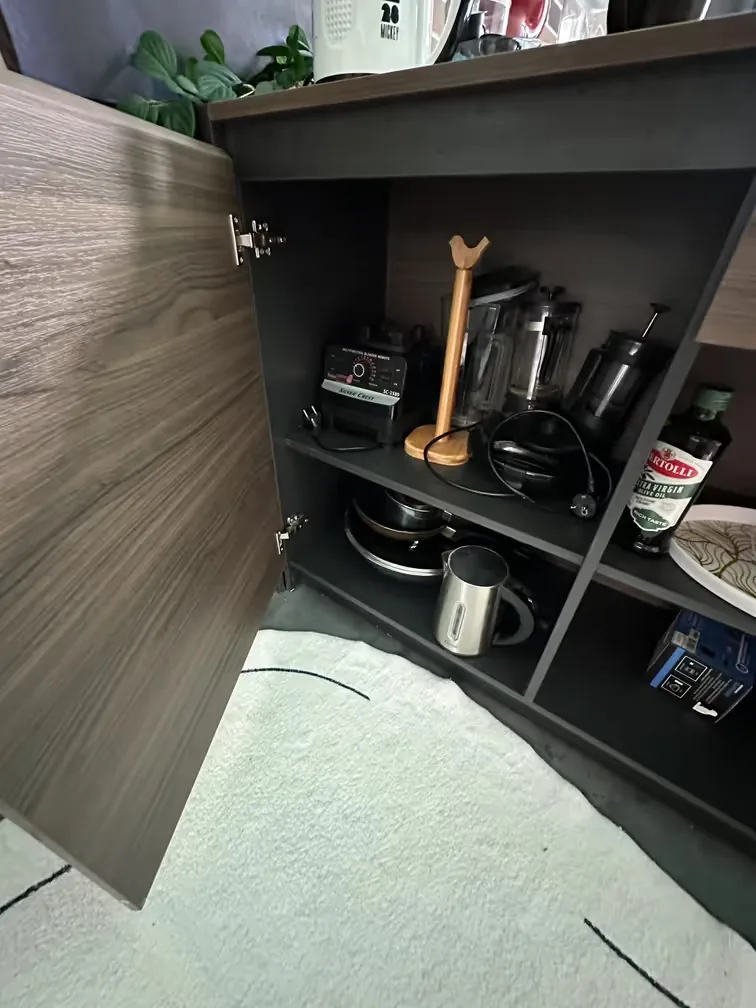Open kitchen cabinet with cookware and appliances — Utopia Nai Harn, Nai Harn
