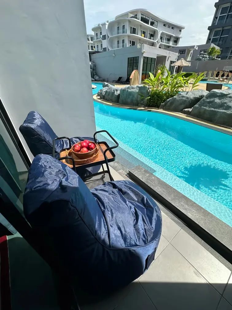 Terrace with bean bag by the pool — Utopia Nai Harn, Nai Harn