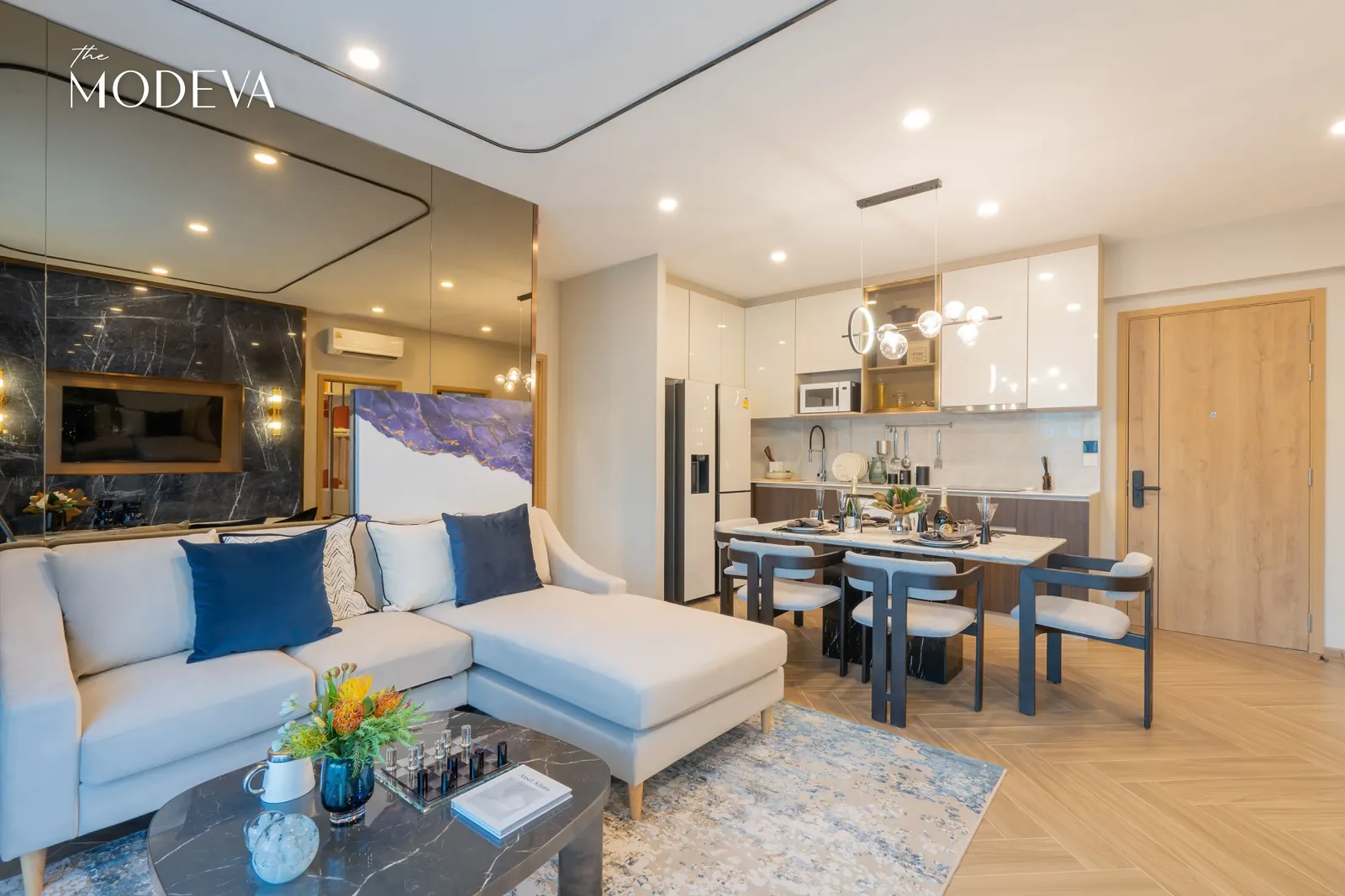 Living room with corner sofa and dining table — The Title Modeva, Bang Tao