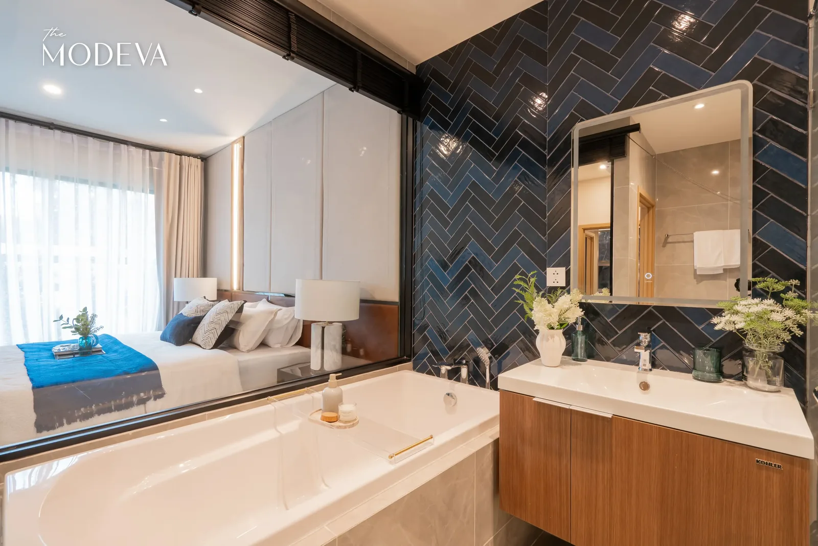 Bathroom with tub by the headboard and washbasin — The Title Modeva, Bang Tao