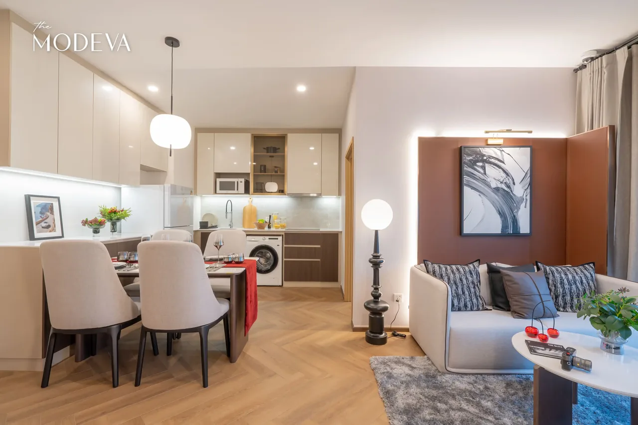 Living room with dining table and kitchen beyond — The Title Modeva, Bang Tao