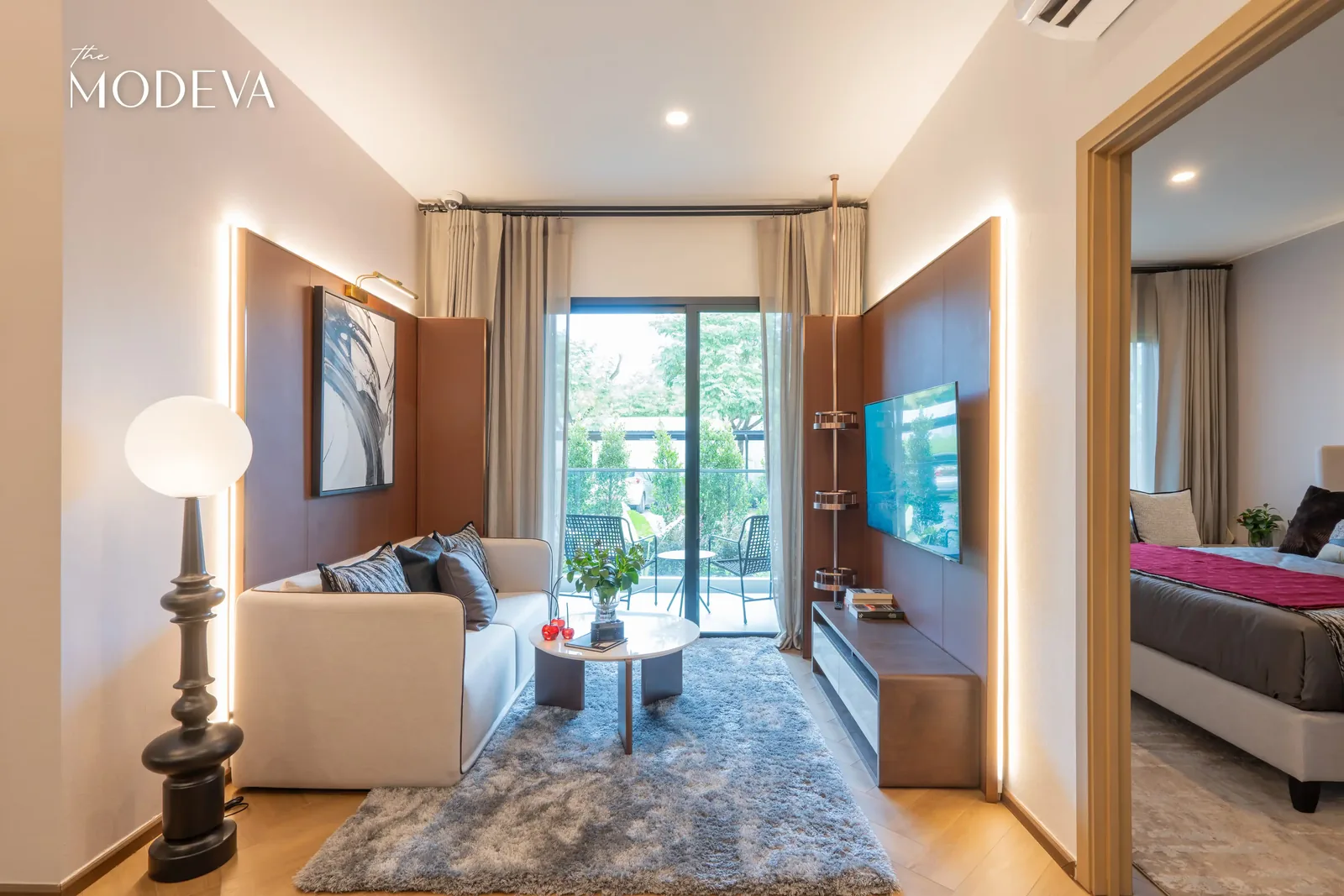 Living room with TV and bedroom behind a partition — The Title Modeva, Bang Tao