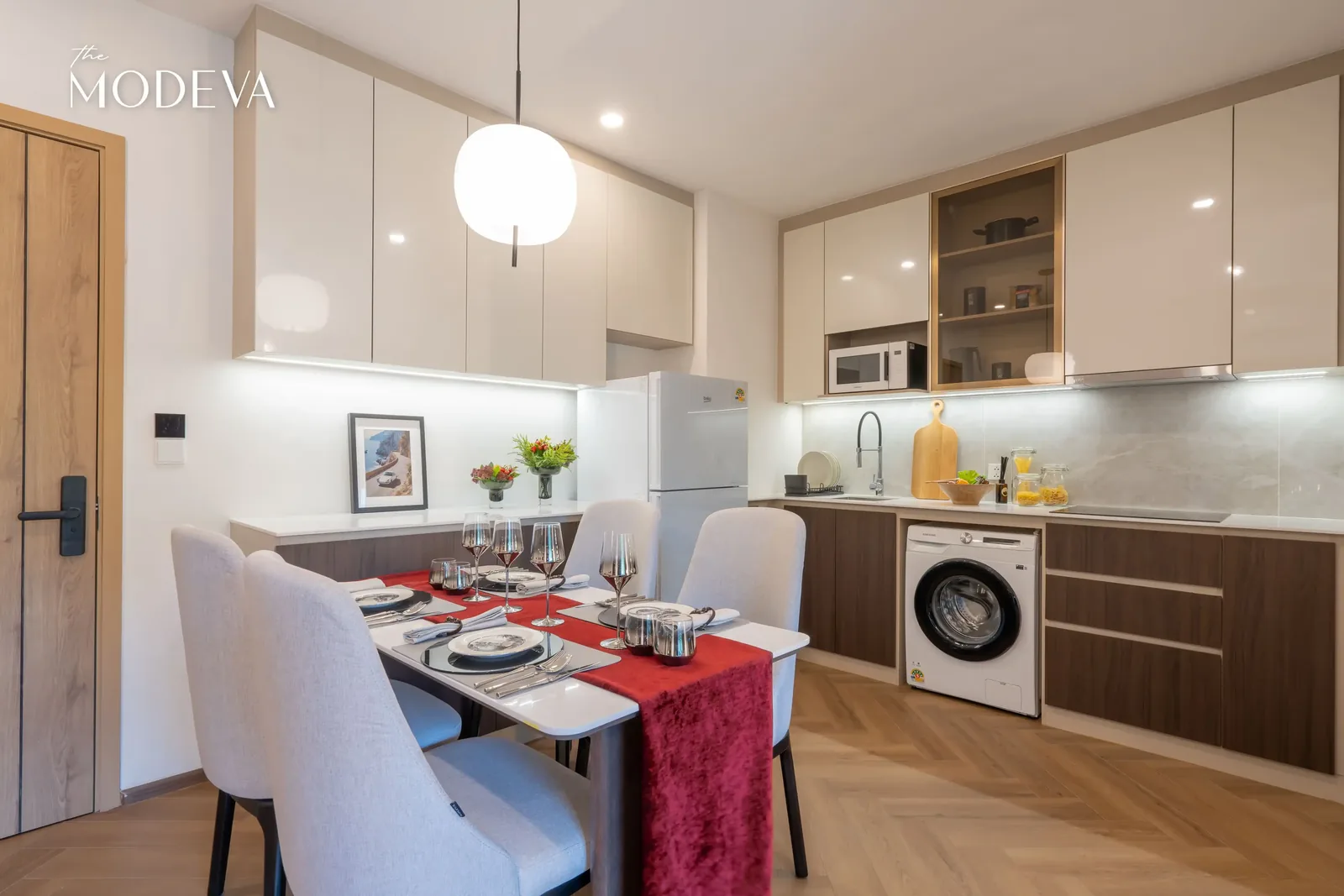 Kitchen with washing machine and dining table — The Title Modeva, Bang Tao