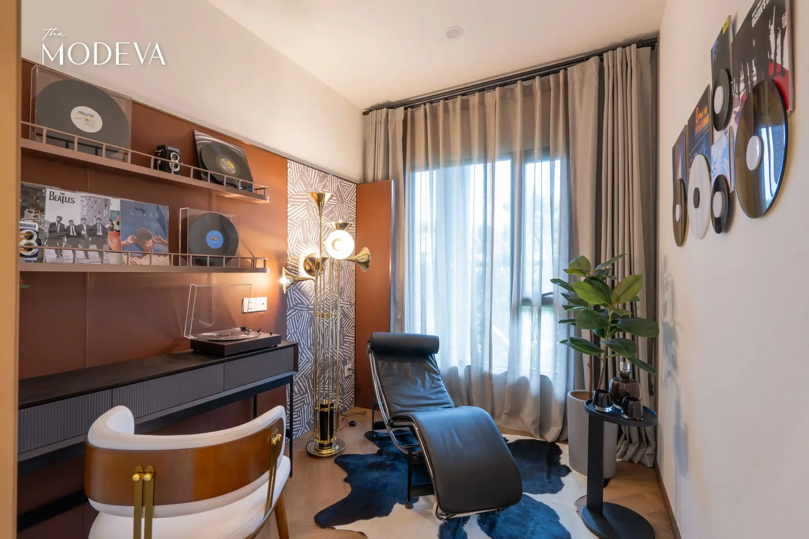 Work space with lounge chair and shelving by the window — The Title Modeva, Bang Tao