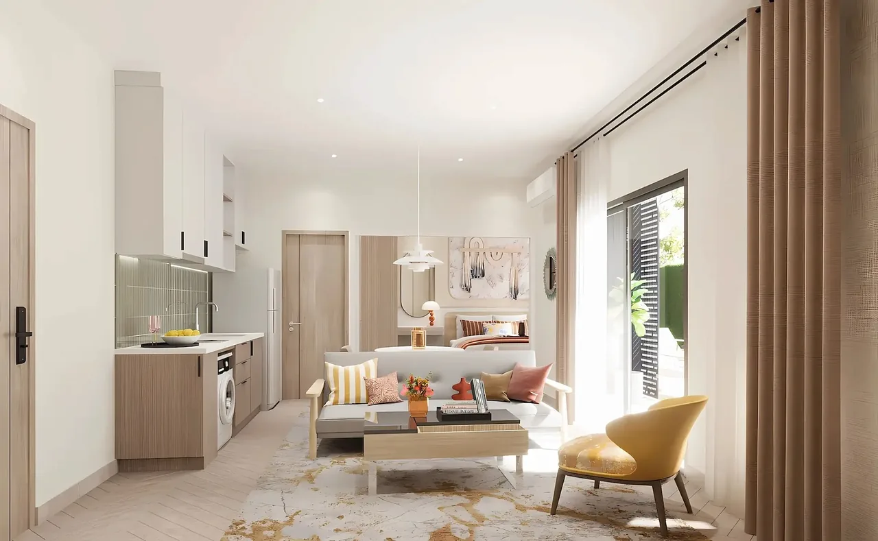 Open-plan kitchen and living room with sofa and armchair by the patio door — The Title Cielo, Rawai