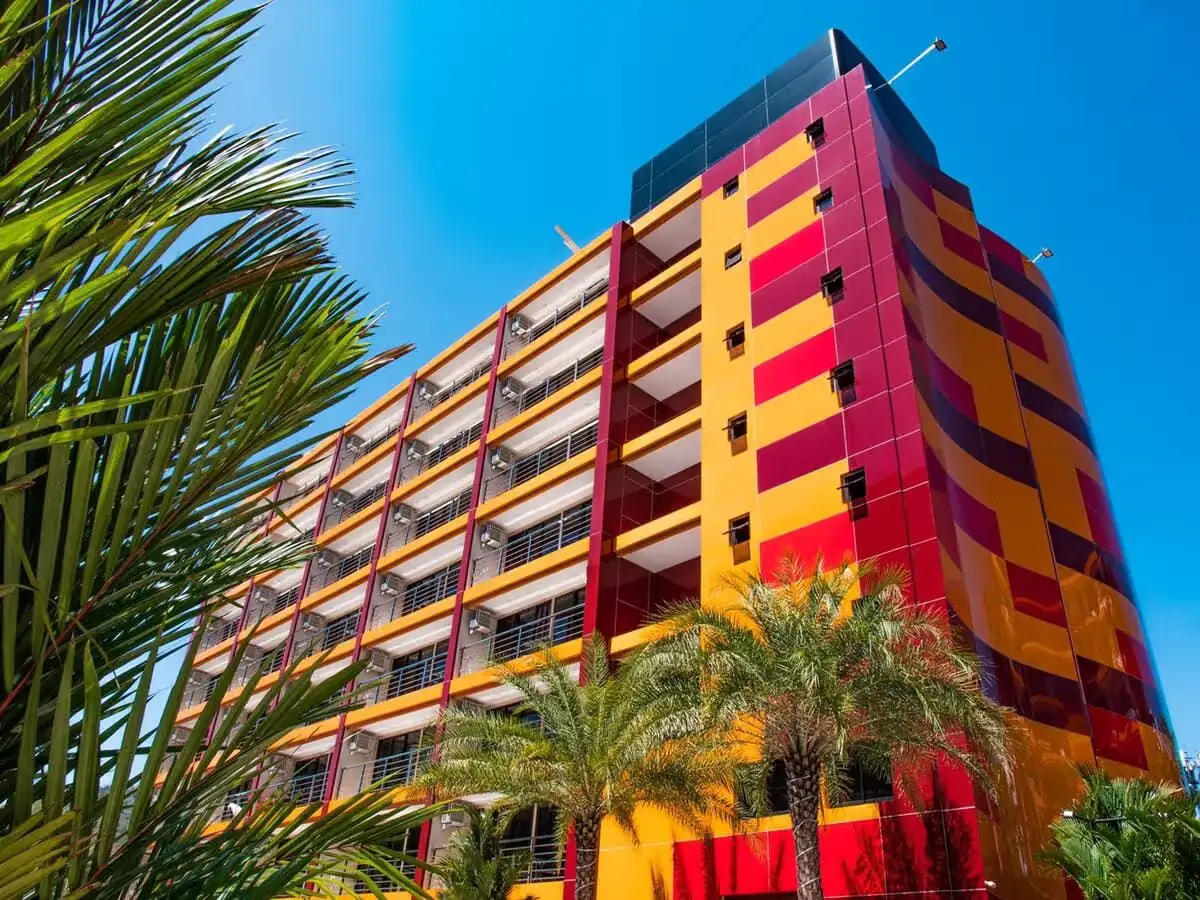 Фасад корпуса в жёлто-красной отделке — NBC / Nai Harn Beach Condo, Найхарн