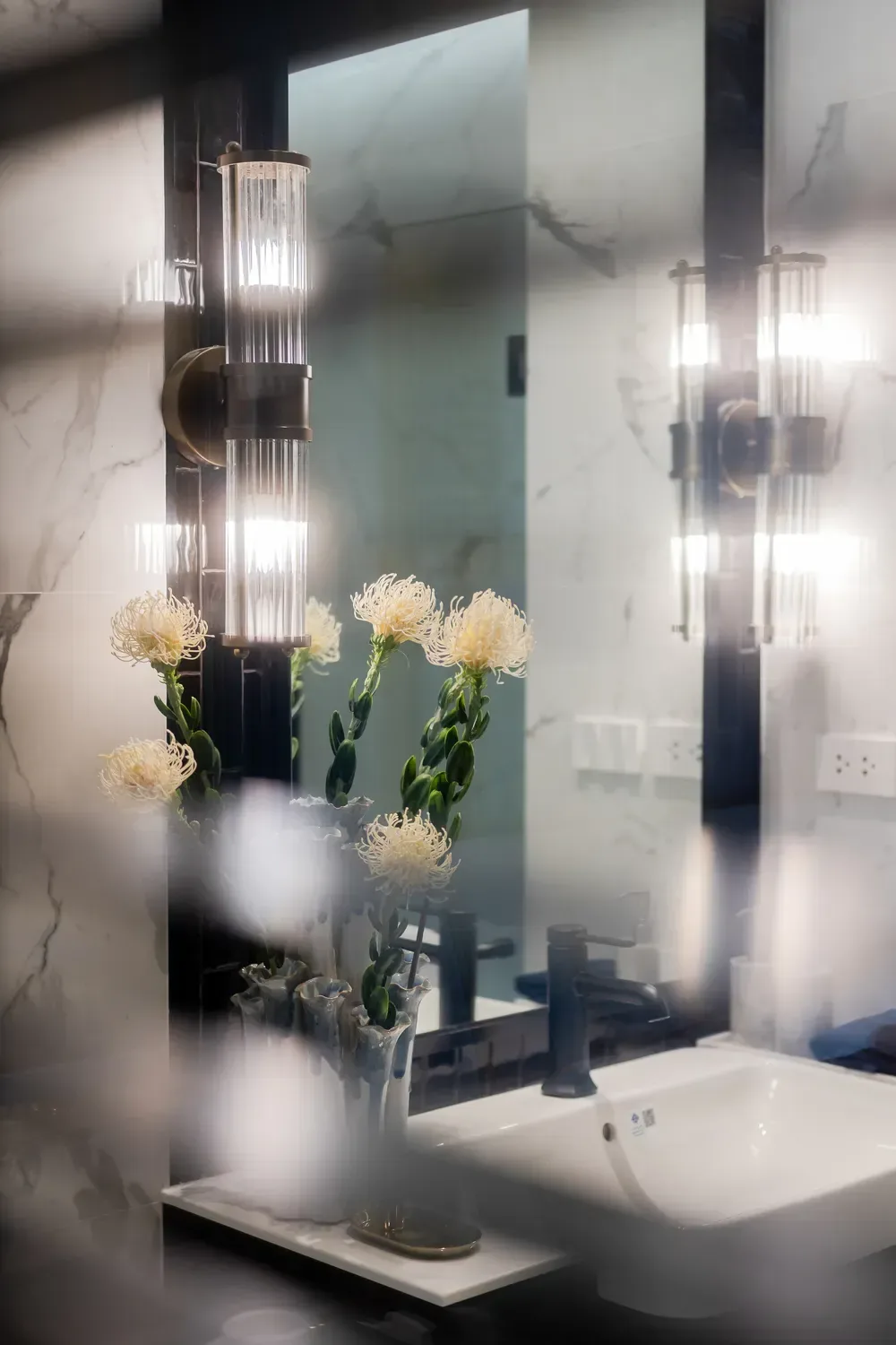 Marble-finished bathroom with mirror and sconces — The Title Heritage, Bang Tao