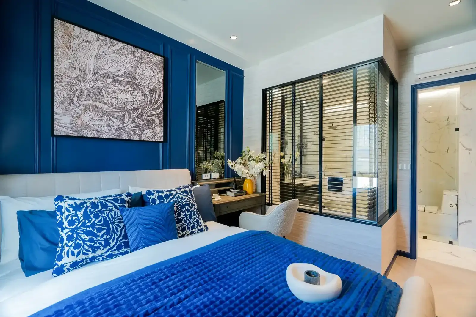 Bedroom with artwork above the bed and bathroom access — The Title Heritage, Bang Tao