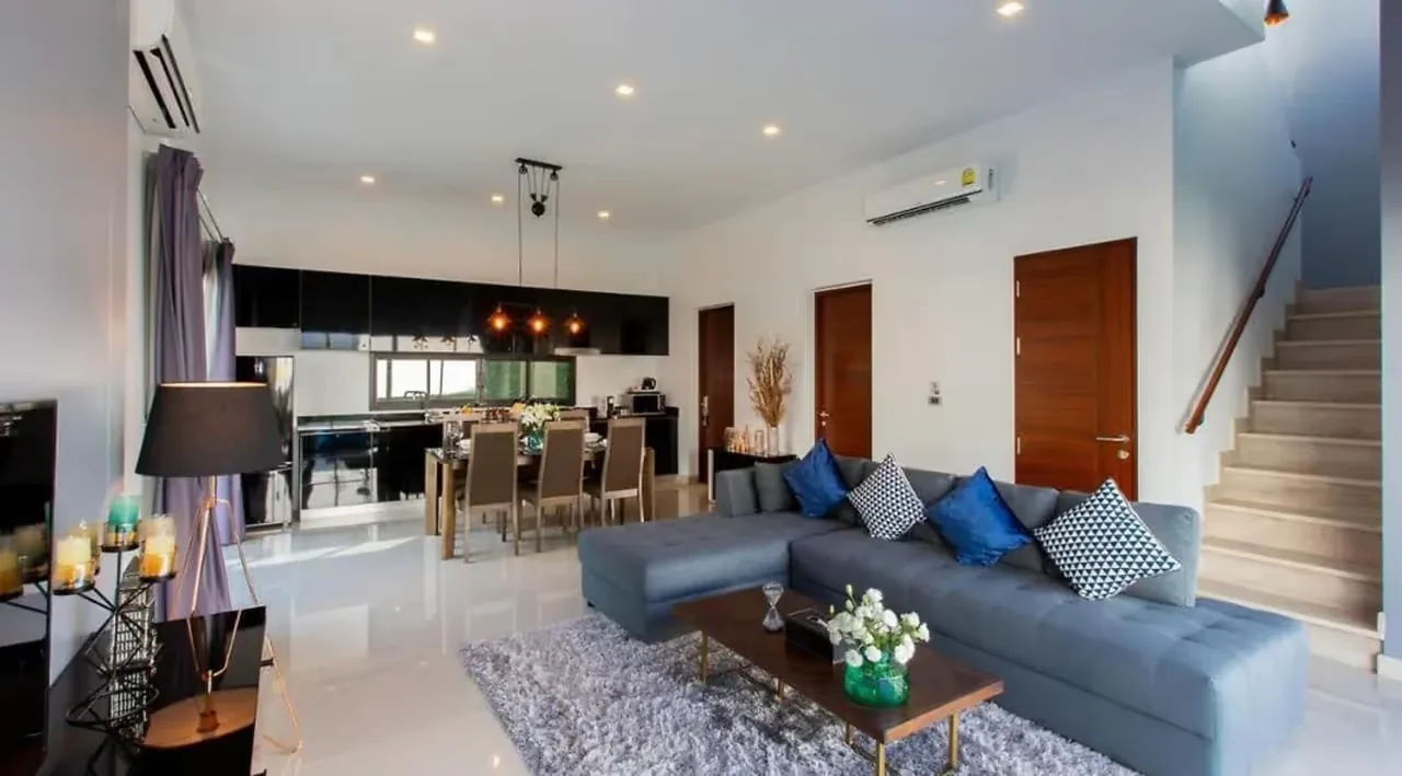Living room with kitchen and stairs to the first floor — Utopia Nai Harn, Nai Harn