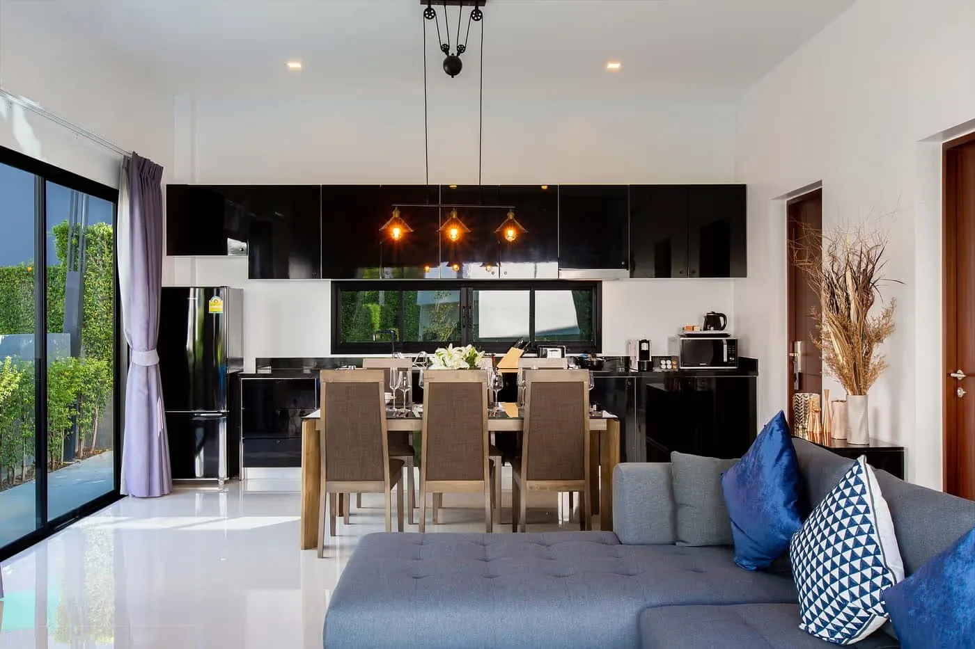 Kitchen and dining area with a table for eight — Utopia Nai Harn, Nai Harn