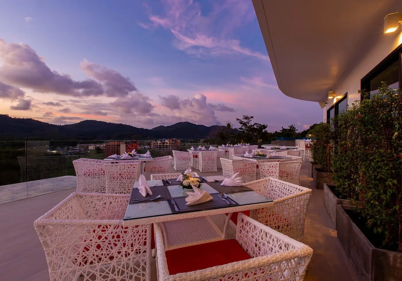 Restaurant terrace tables at sunset — Utopia Nai Harn, Nai Harn