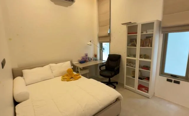 Bedroom with work space and shelving unit — Ban Bua, Nai Harn