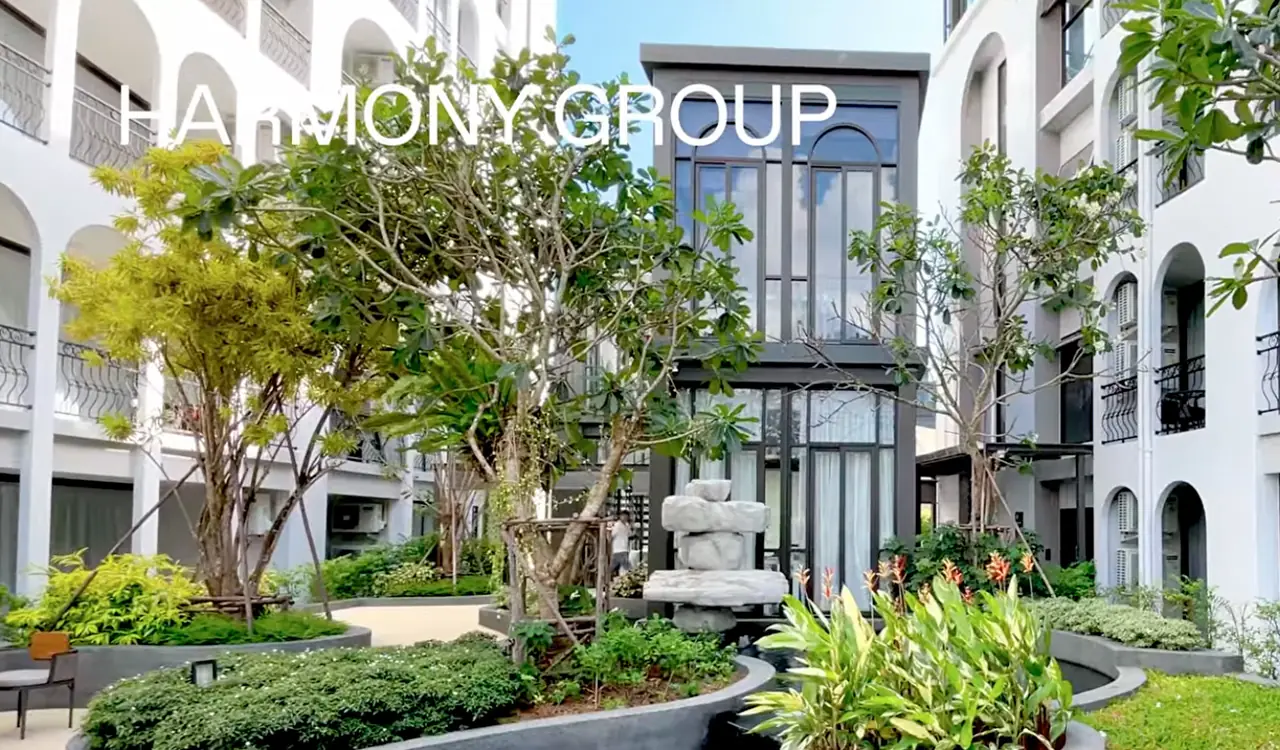 Courtyard with trees and a sculpture — Harmony, Nai Harn