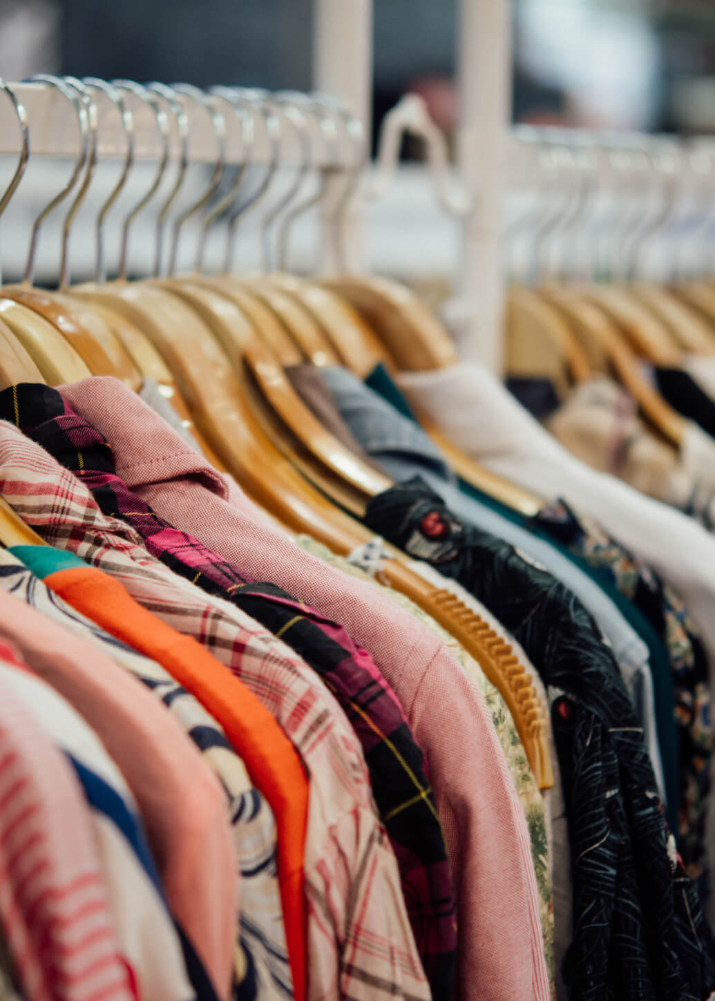 a rack of shirts hanging in a store